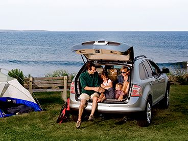 Open liftgate with family camping