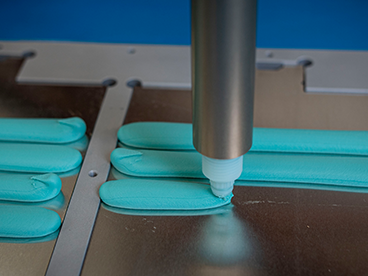 Automated, high-volume dispensing of BETATECH™ thermal interface material
