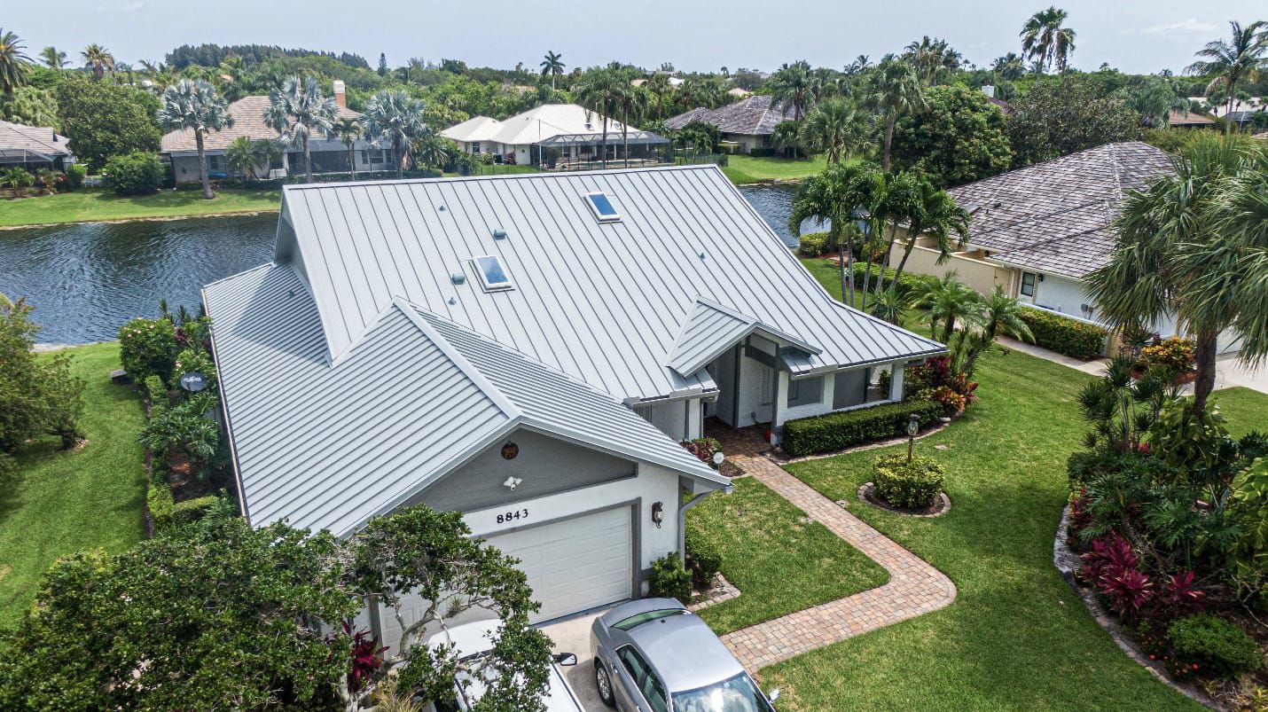 COASTALUME™ roofs provide impressive 50-year warranties even in proximity to brackish water sources, exemplified by this residence along an intracoastal Florida waterway