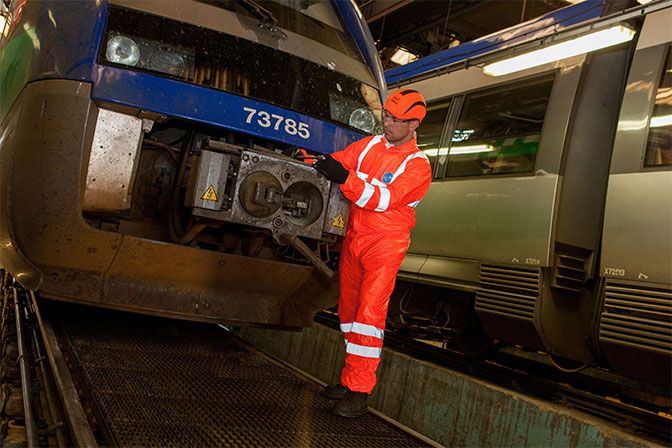 An SNCF railway worker wears Tyvek® coveralls to stay safe on the job