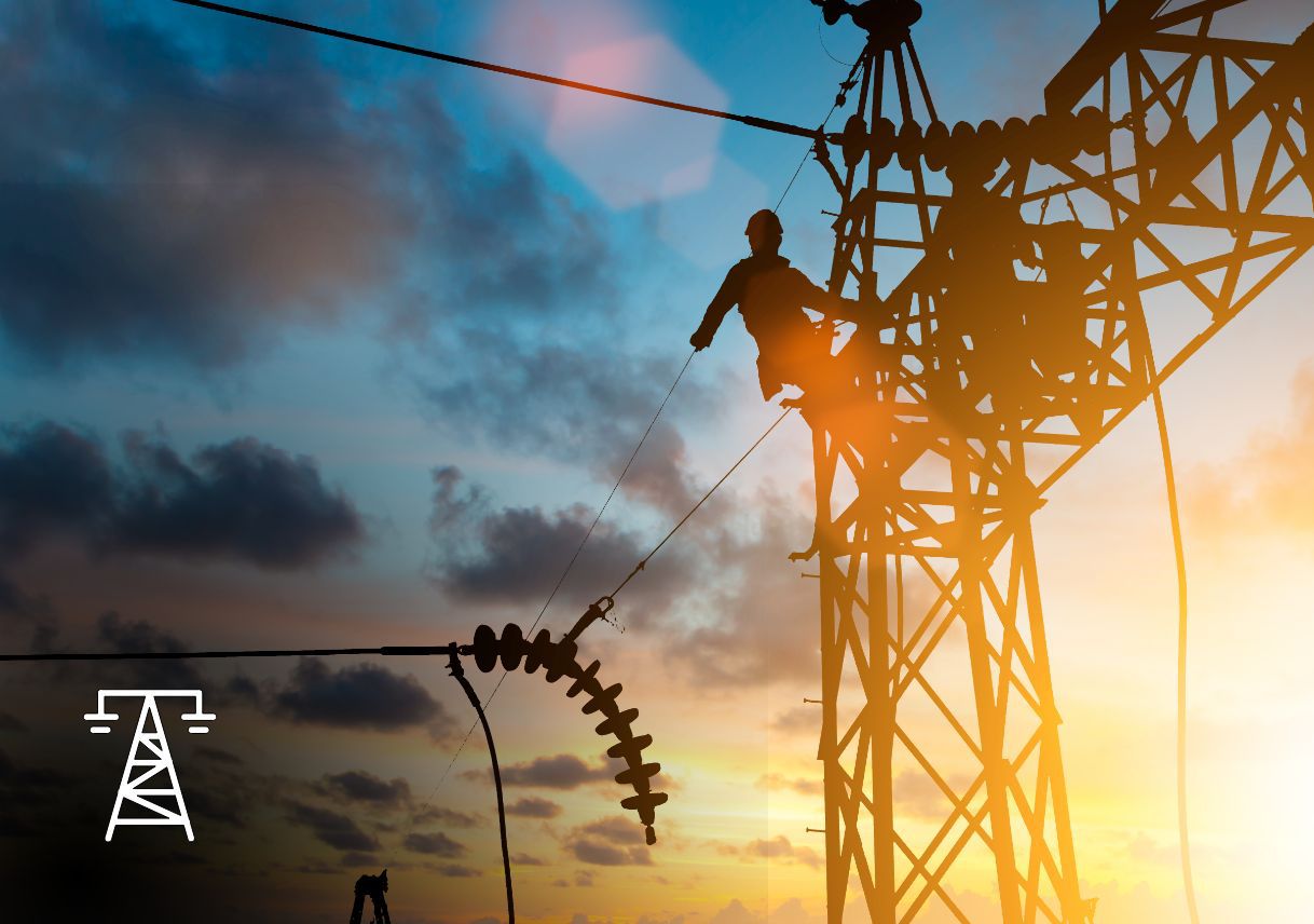 An electrical worker at the top of an electrical tower