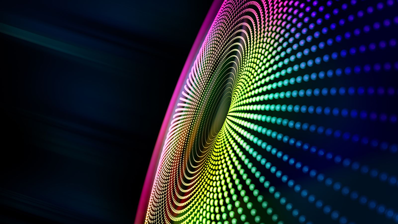 Digital generated image of multicolored particles forming eye shape against black background.