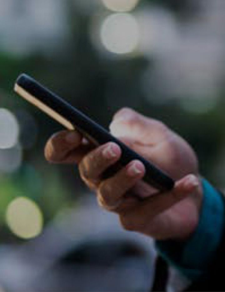 Hand holding a smartphone symbolizing DuPont Enabled Connections