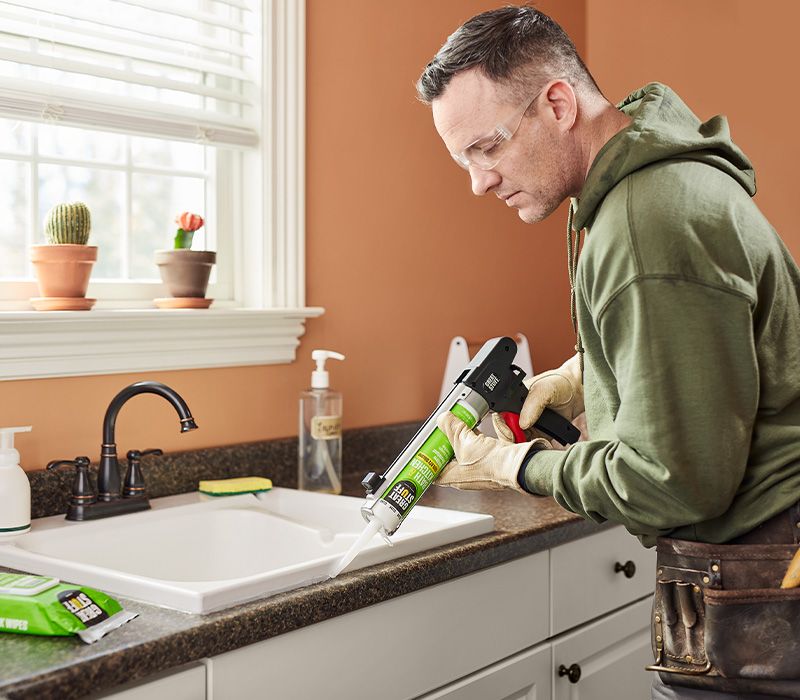 https://dupont.scene7.com/is/image/Dupont/clear-bath-kitchen-silicone-caulk-product-image-2