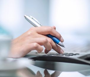 Person using calculator 