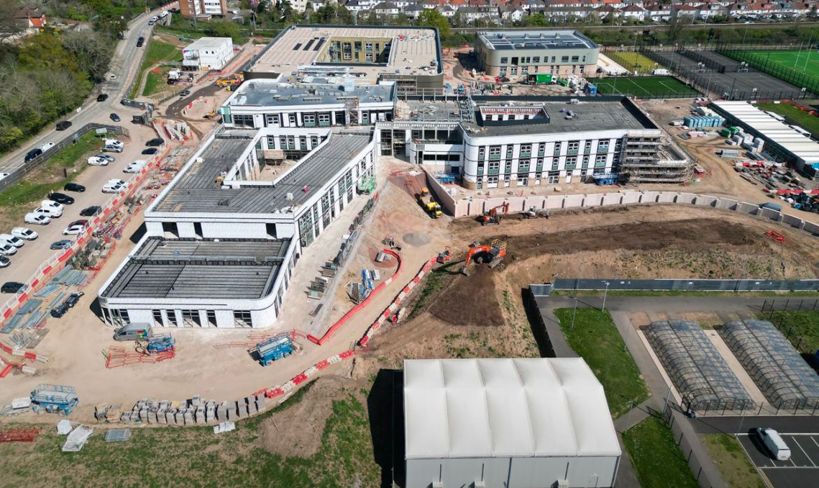 Aerial view of Fairwater Community Campus construction site with multiple buildings