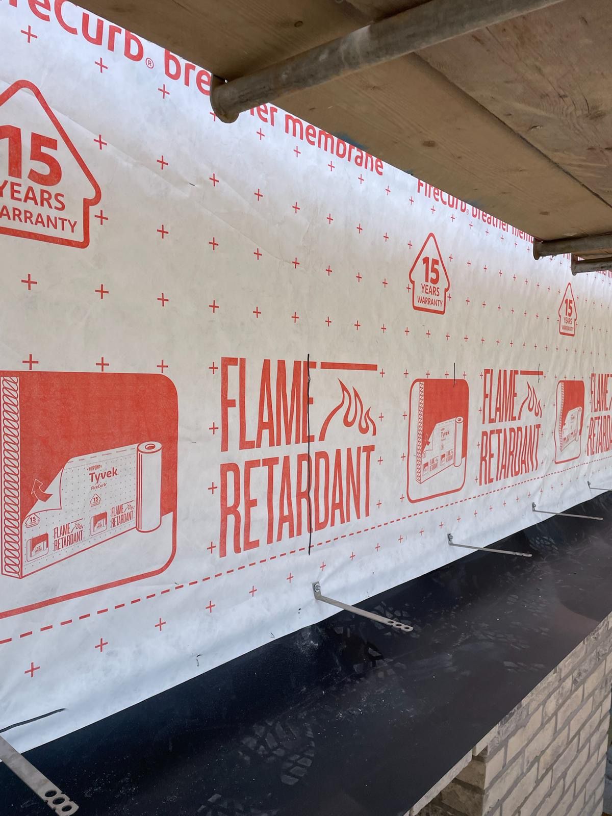 Fairwater Community Campus construction site showing flame retardant Tyvek membrane