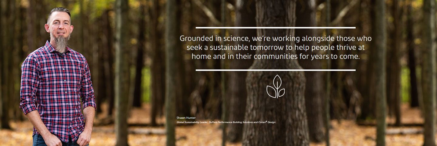 Large commercial building with callouts to certain places on the building which shows the DuPont material used in construction