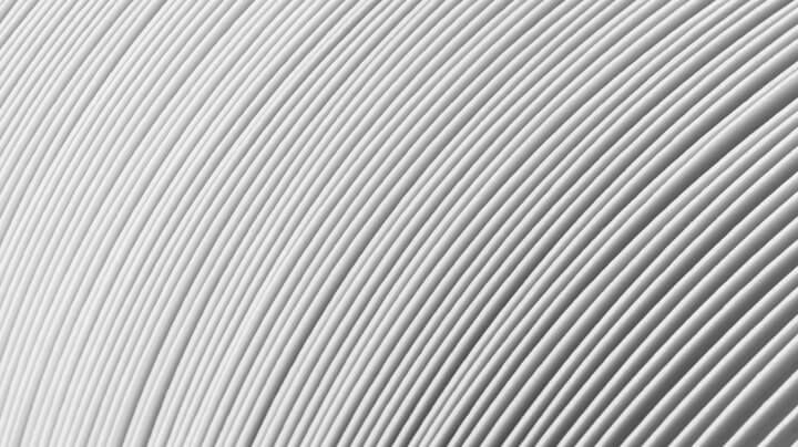 Extreme close-up of a stack of folded white paper produced by the pulp and paper industry.