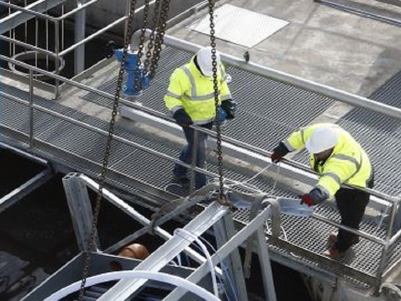 Two men working in facility
