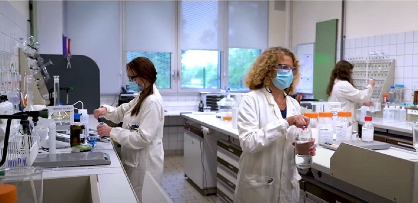 Scientists in a lab working with pharmaceutical excipients