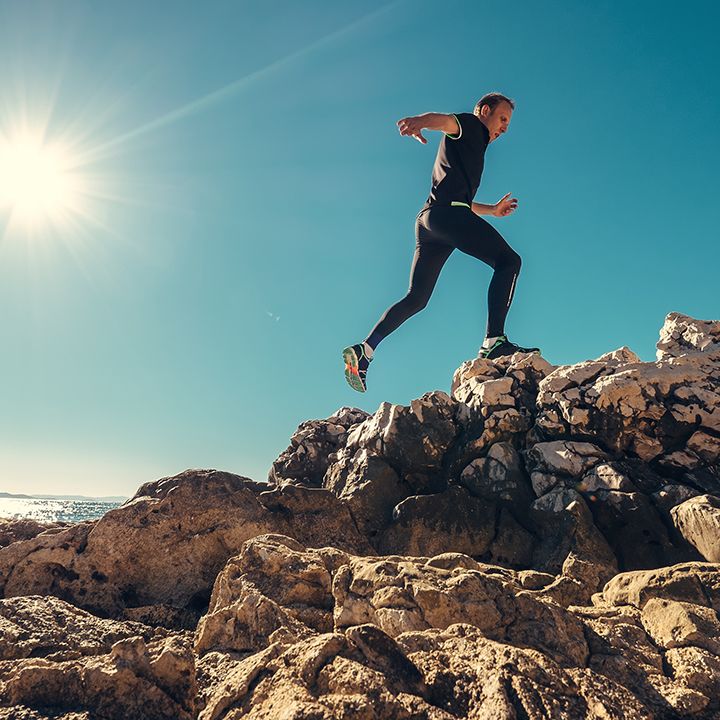 Man running on rocks. 