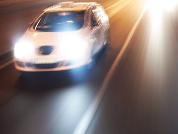 Car on highway at night.