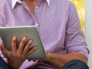 Man working on tablet.