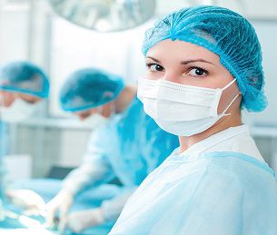 Cheerful surgical team is working in surgery